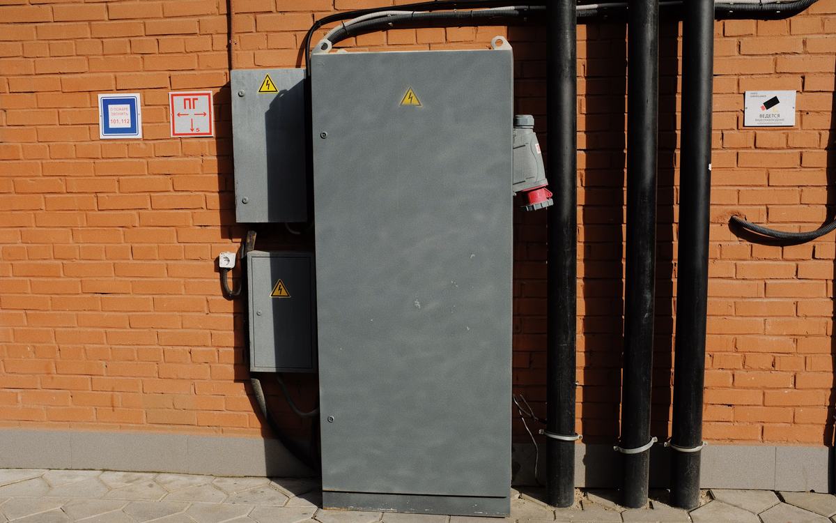 Electrical cabinets mounted on a brick wall
