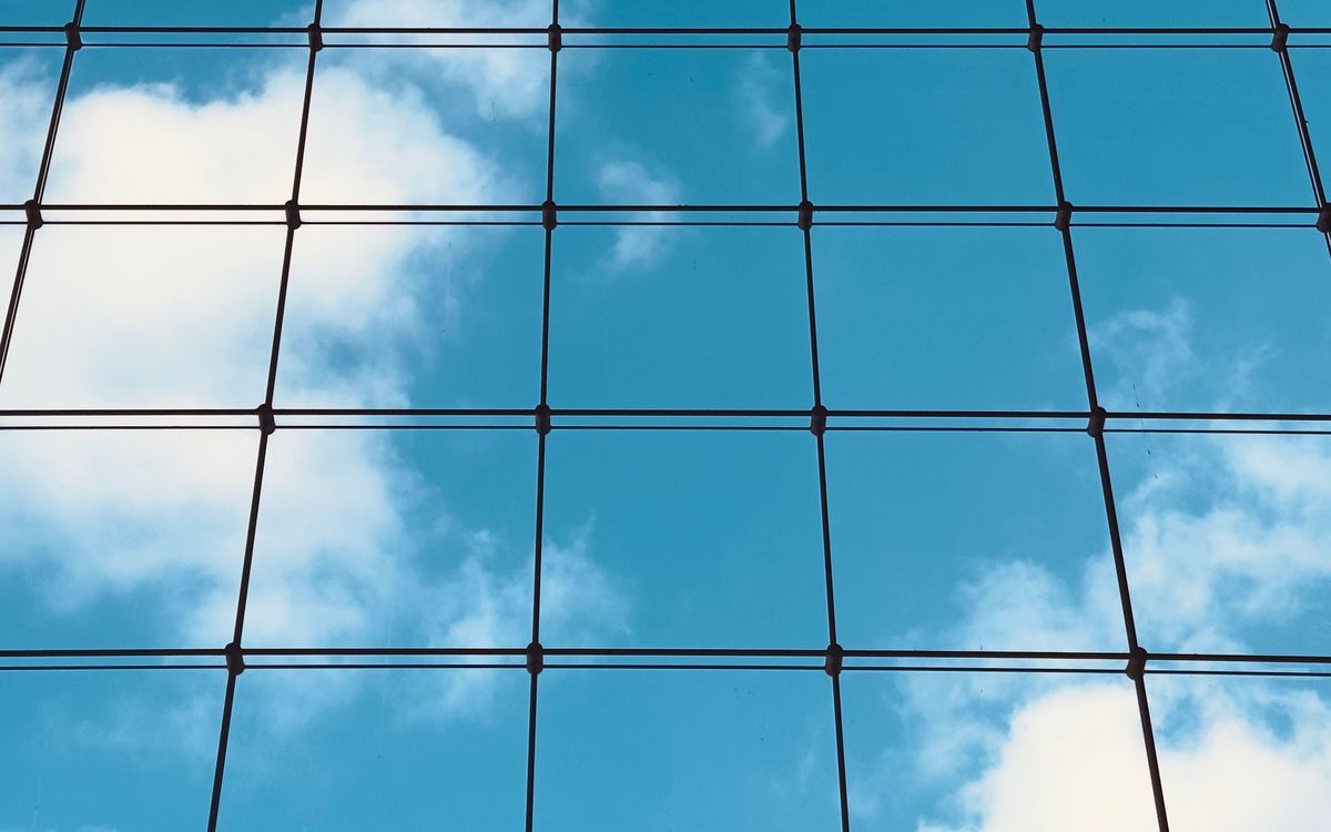Clouds reflected in a glass facade
